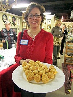 Angela Pugh offers appetizers at an "Elegant Dining for the Symphony" event.