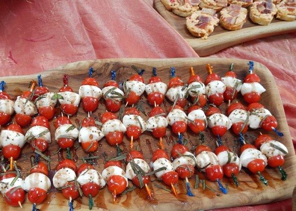 Caprese skewers garnished with the Convention Center's garden lemon basil.